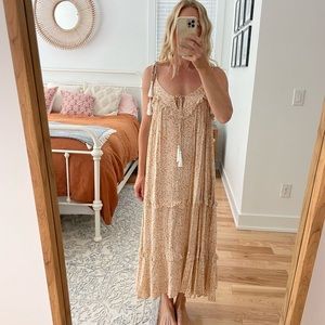Boho floral print maxi dress with tassels.